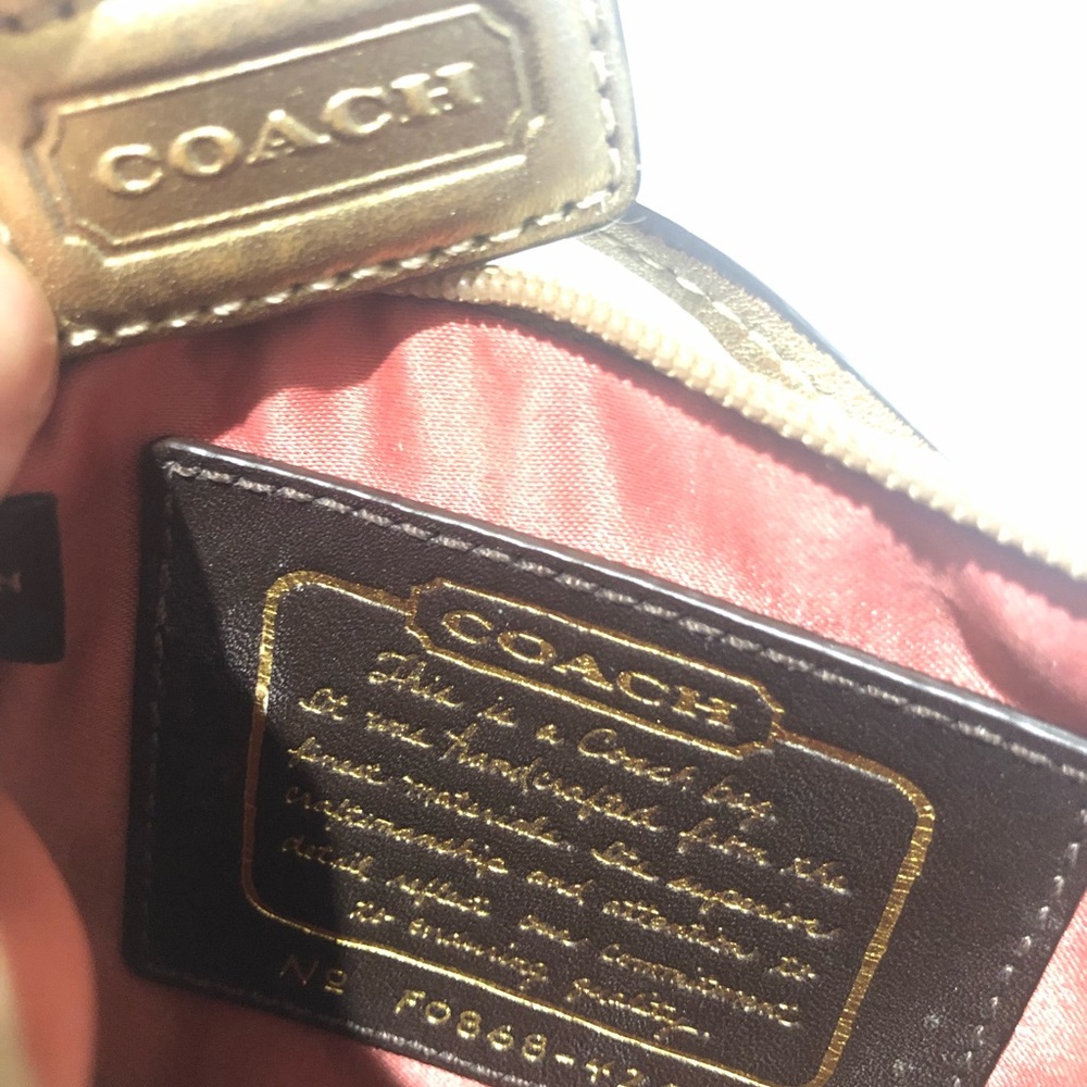 COACH small gold wristlet, stud details. Authentic. Like new